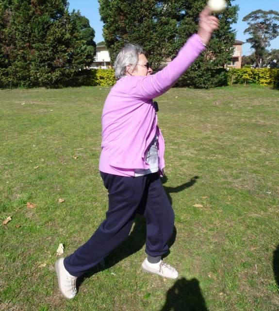 Margaret Slowgrove demonstrates throw of Vigoro ball, Booralee Park, Botany